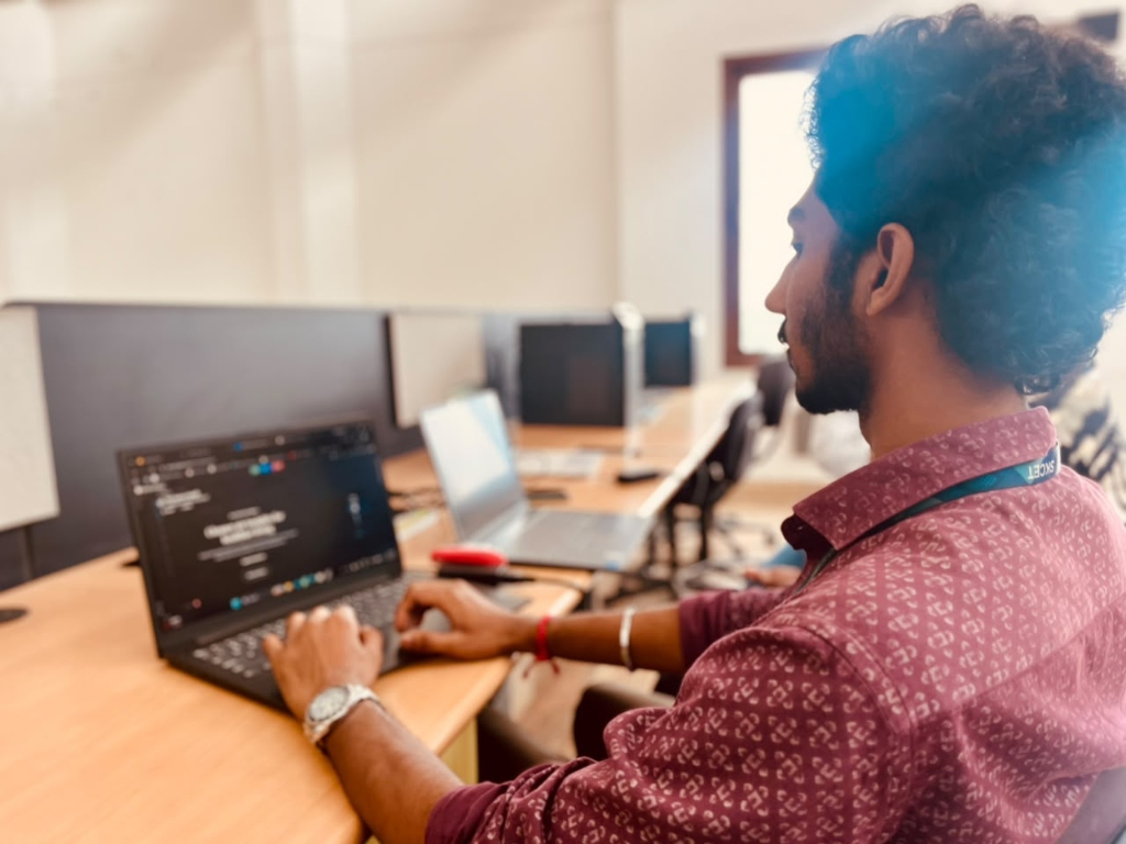 Rejiesh Ashwanth focused on coding and product architecture at his laptop